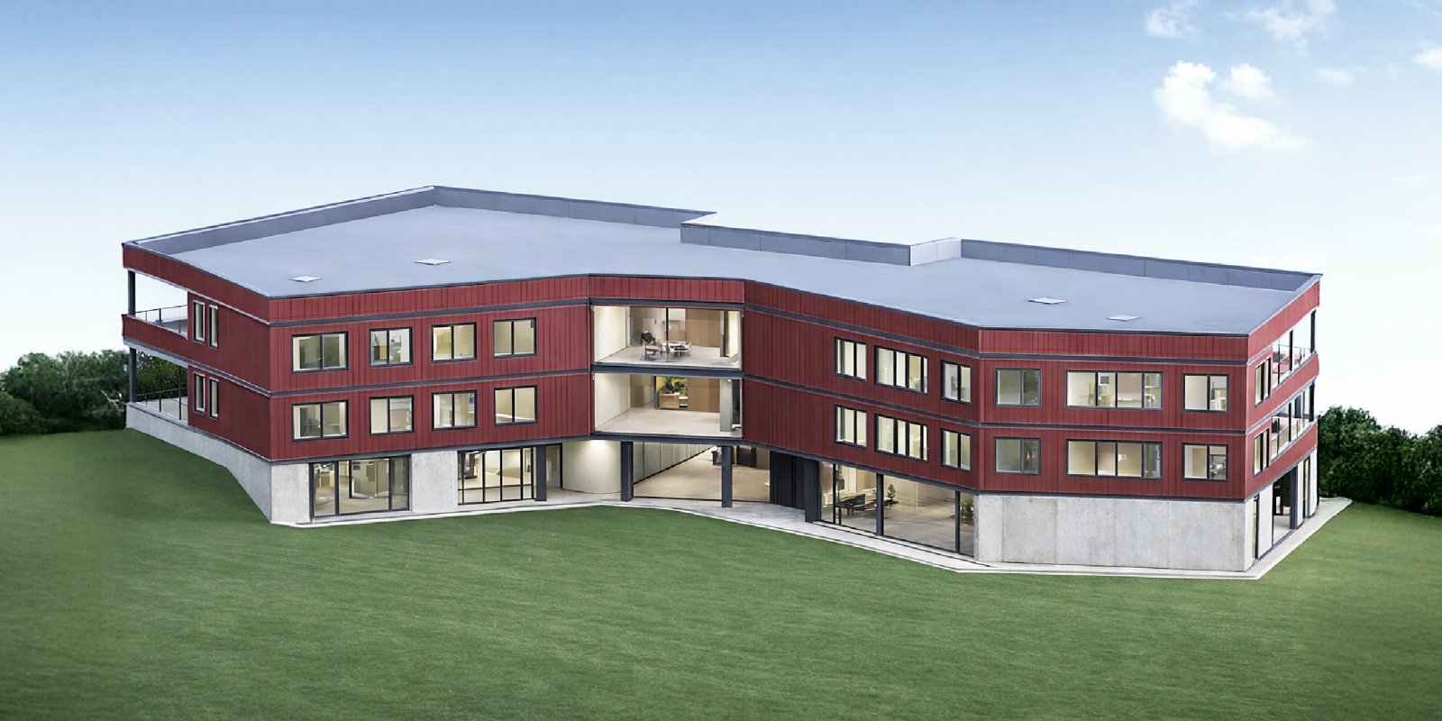 Visualisierung moderne Grundschule in Freiberg mit roter Holzfassade, Beton-Skelettbau und klar gegliederter Architektur in nachhaltiger Hybridbauweise